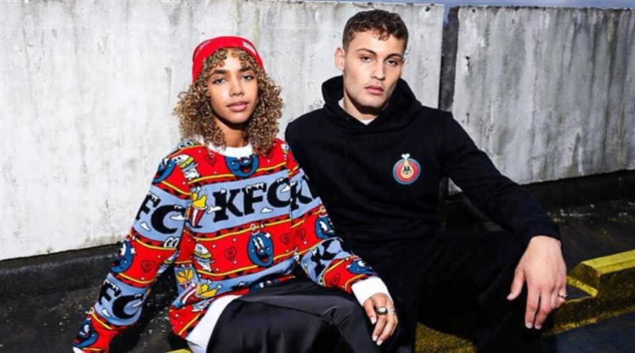 Woman and man wearing KFC merch