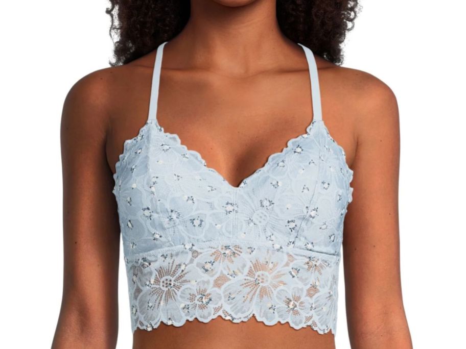 woman wearing No Boundaries Juniors' Longline Floral Lace Bralette