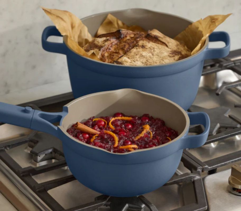 a blue perfect pt duo on a stove top shown cooking food