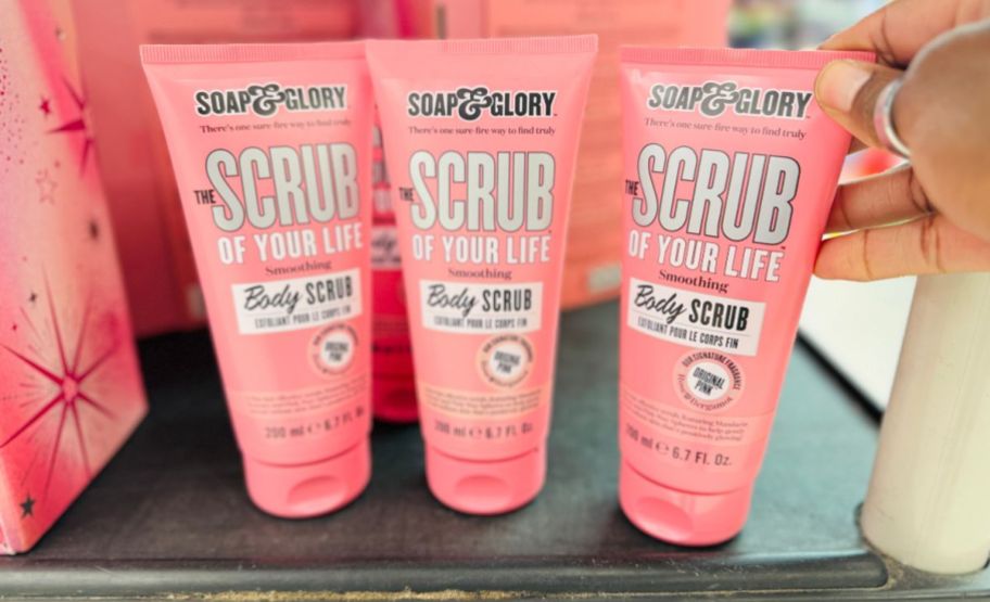 3 tubes of body scrub on a store shelf