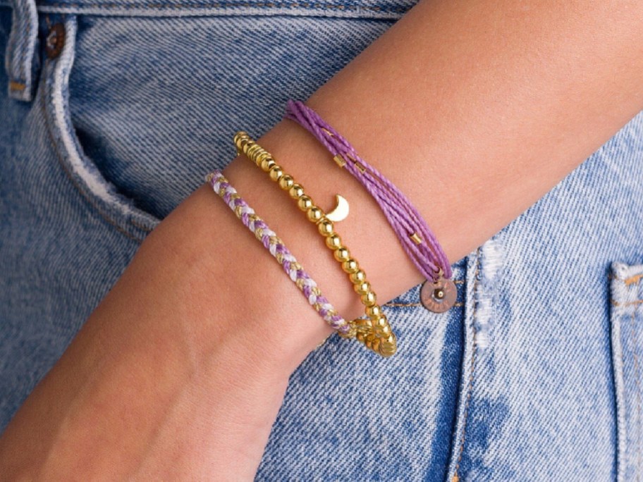 hand holding Pura Vida Mini Moon Pack