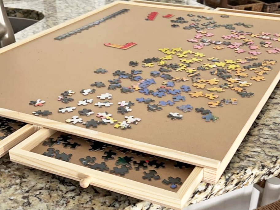 close up of puzzle table with opened drawer