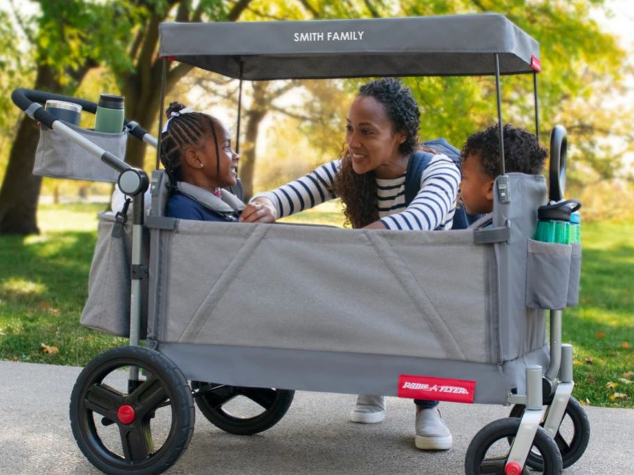 Children inside a Radio Flyer Build-A-Wagon Stroll 'N Wagon