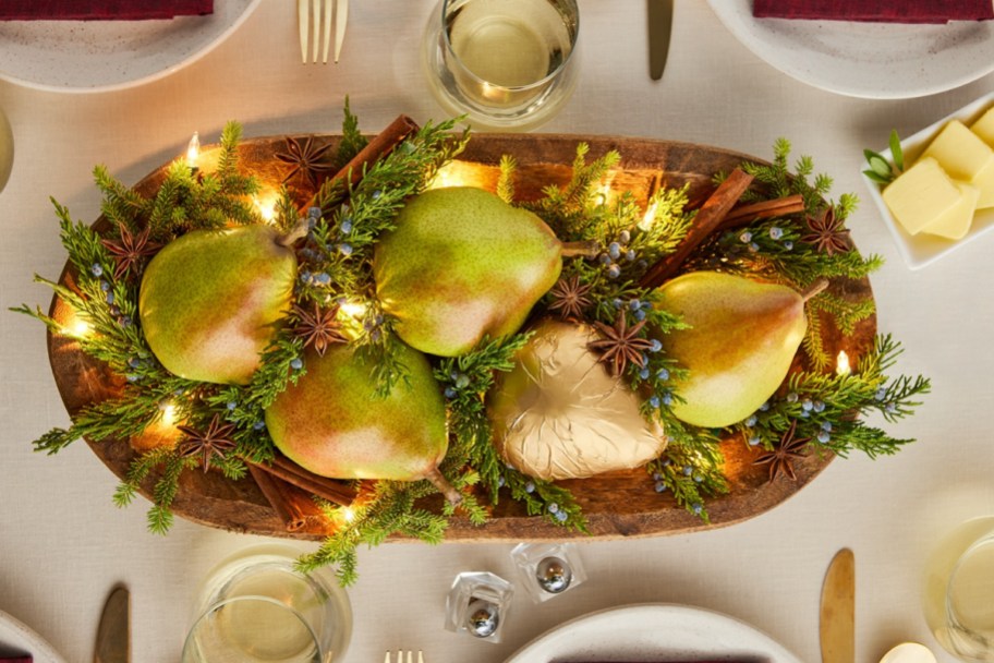 pears on wood platter with lights