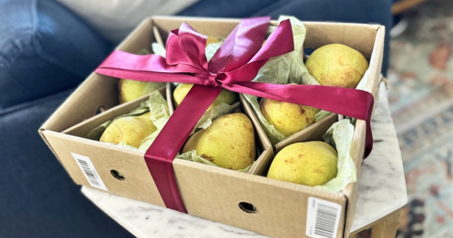 A box of Harry & David Pears with red ribbon