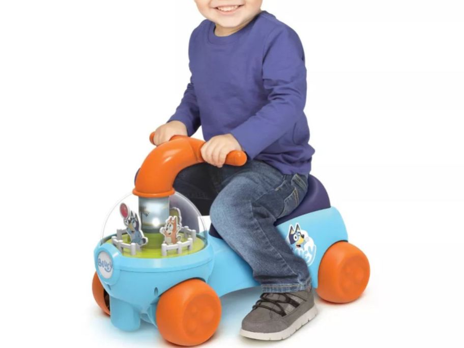 Little boy on a Bluey Keepy Uppy Interactive Play Ride-On