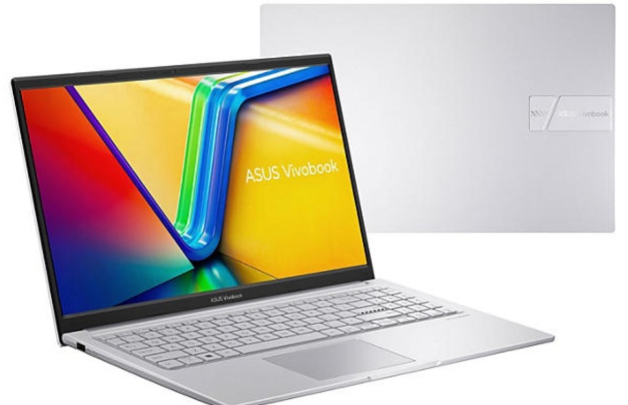 a silver Asus laptop open showing the screen with a colorful background image, there is a closed silver laptop behind it