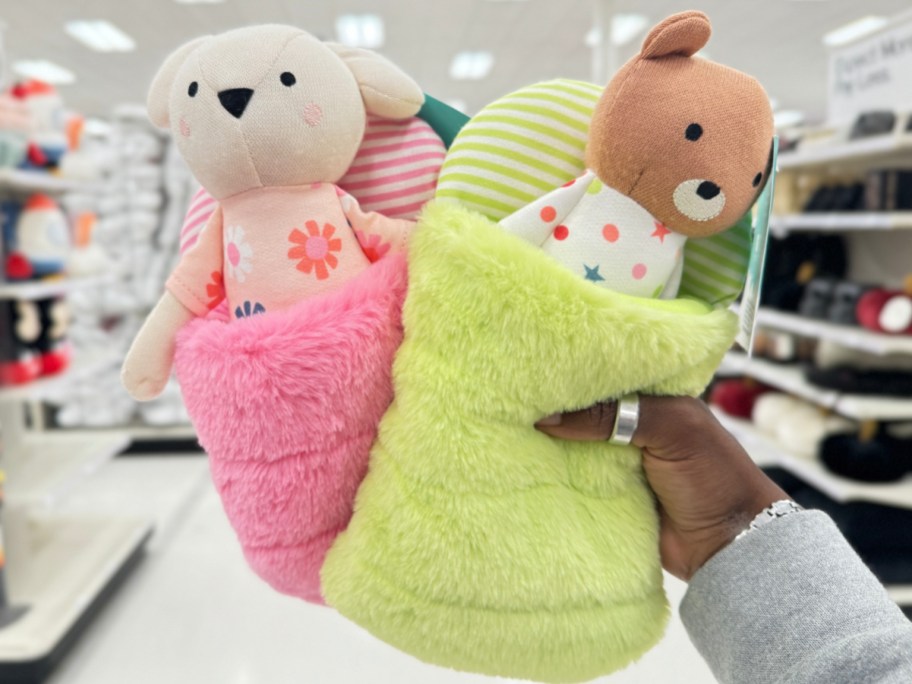 hand holding Pillowfort Kids' Mini Plush with Sleeping Bag in Mouse or Bear