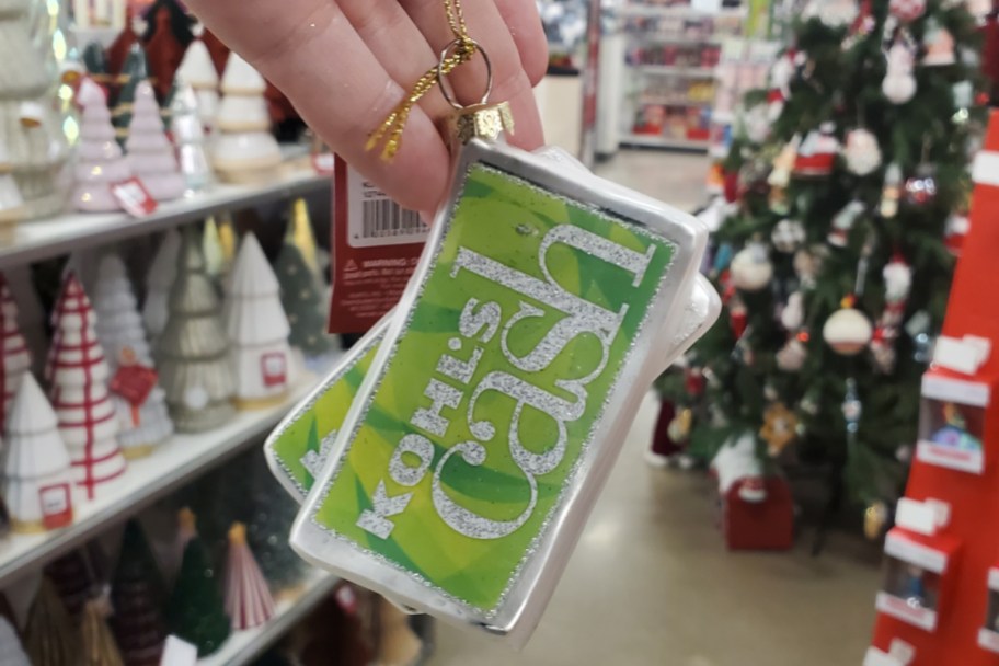 hand holding kohls cash ornament in store