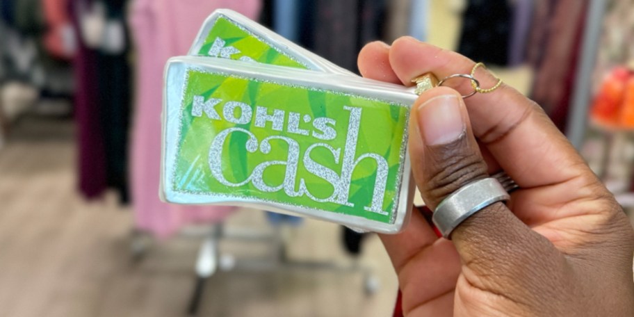 hand holding kohls cash ornament