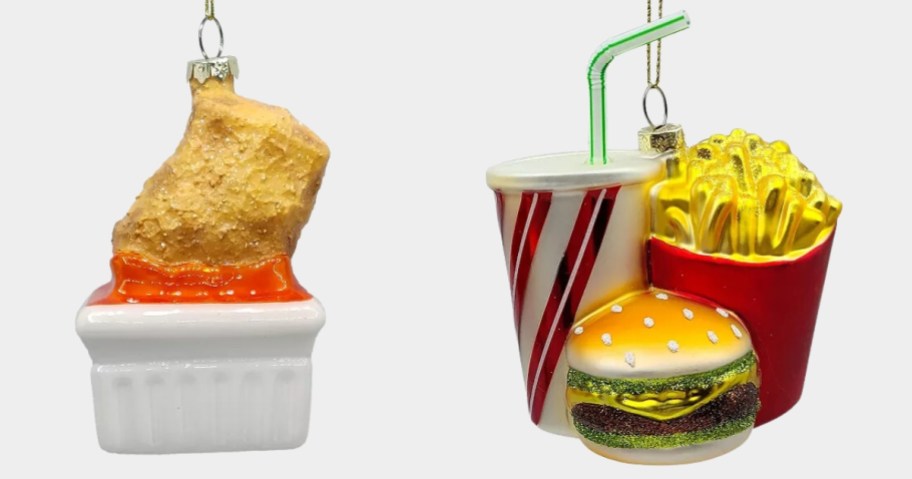 Christmas ornaments one is a Chicken Nugget being dipped in a sauce container and the other is a soft drink with a straw in a cup, a Cheeseburger, and a container of french fries