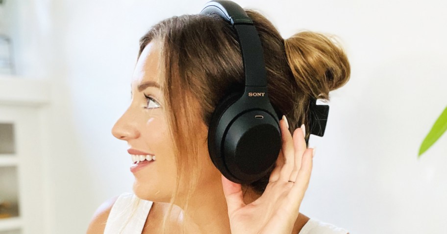 woman wearing a pair of black Sony headphones