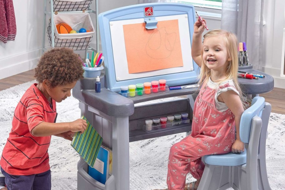 kids playing with Step2 Studio Art Desk