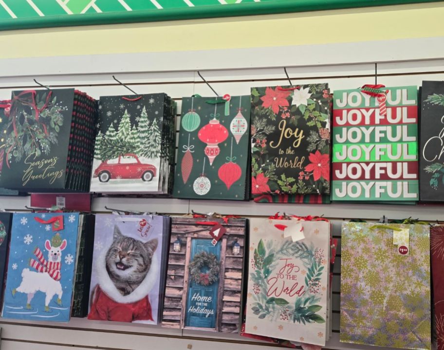 a selection of gift bags displayed on a store wall