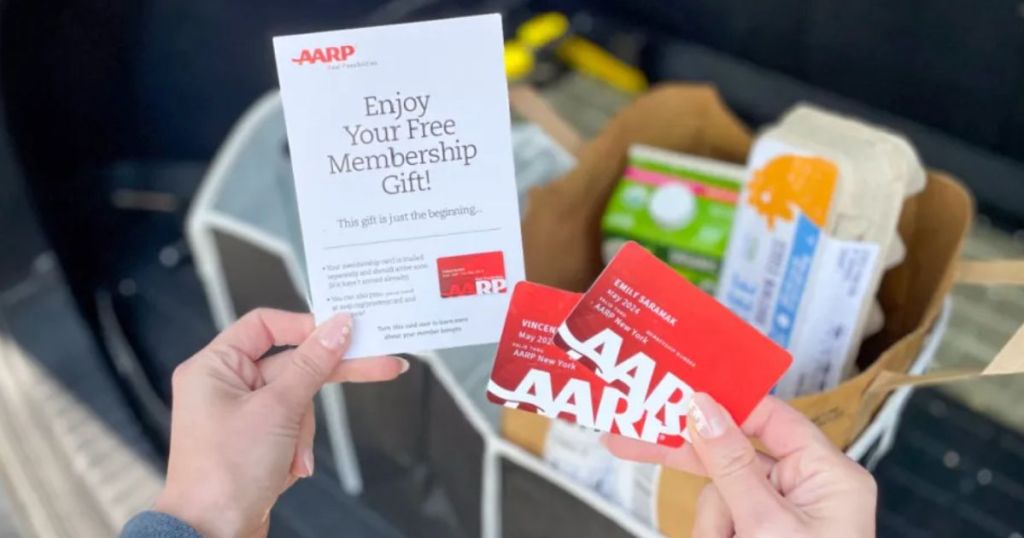 hands holding AARP Membership cards and welcome letter with the Free Trunk Organizer shown in the background