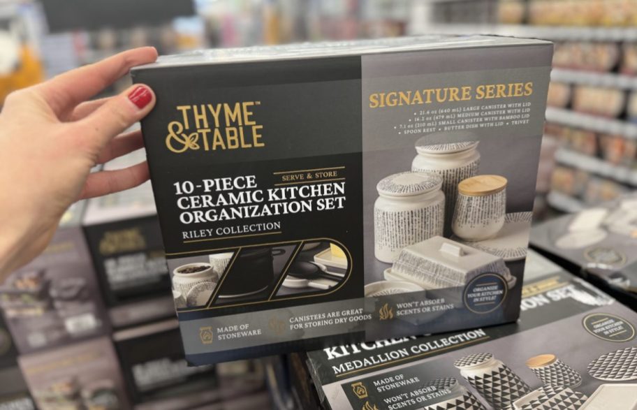 Hand holding a thyme and table ceramic kitchen organization set