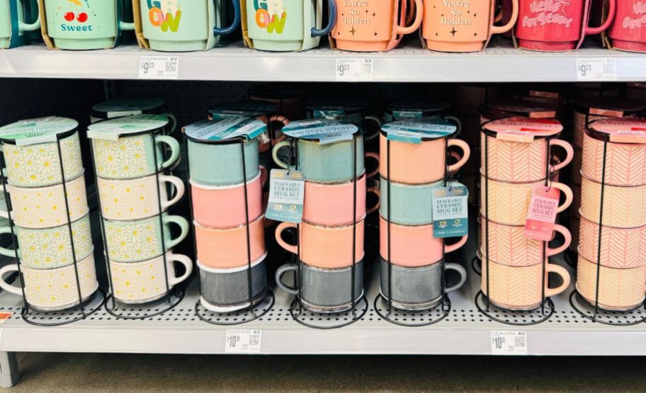 rows of stacking mug sets on a store shelf