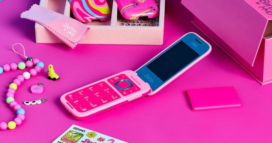 Tracfone HMD Barbie Flip Phone w/ Accessories on pink table