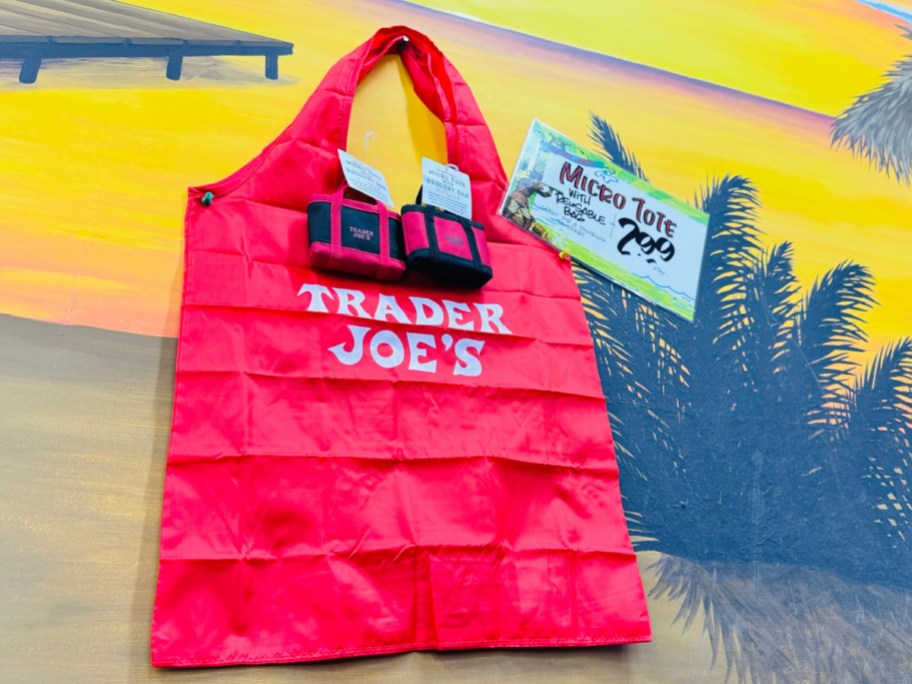 Trader Joe with shopping bag displayed on the outsdie