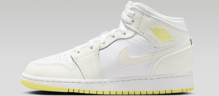 kid's Nike Air Jordan mid shoe in white with off white and light yellow accents