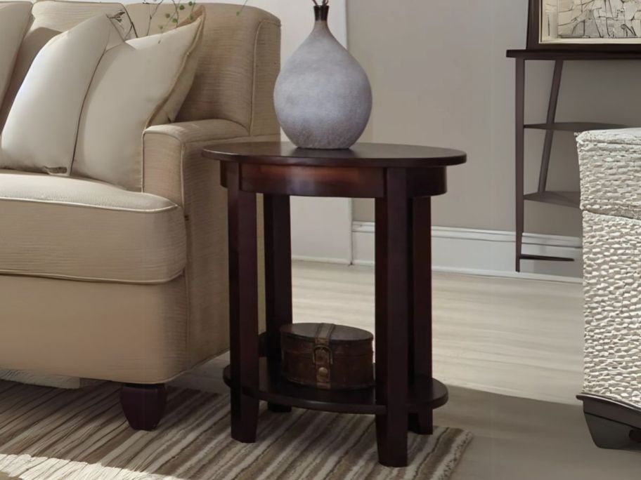 Alaterre Furniture Round Accent Table beside couch in living room