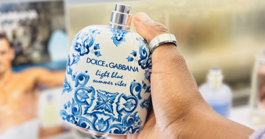 Woman holding Dolce & Gabbana Light Blue Bottle in store