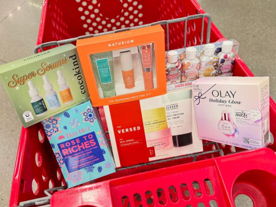 A Target Shopping Cart with several beauty gift sets in the front basket