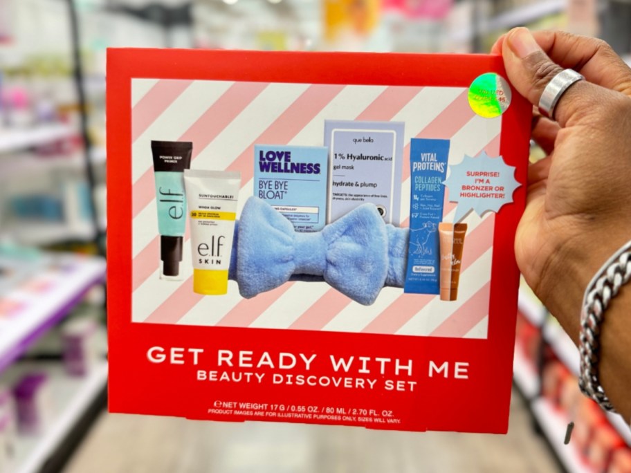 hand holding a red box with beauty products on the front that's a Get Ready With Me Beauty Discovery Set