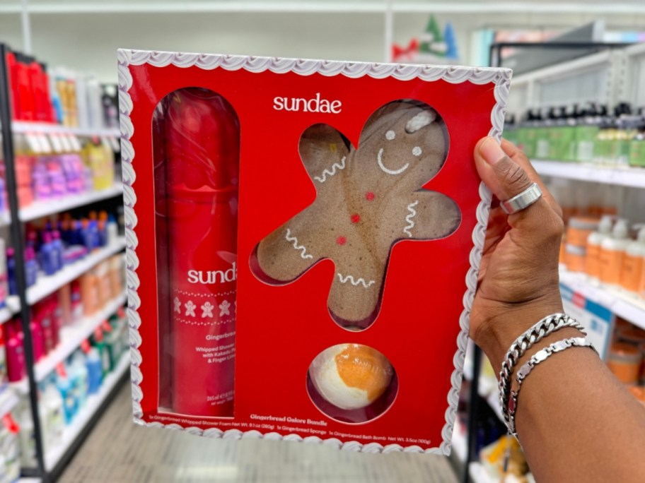 hand holding a red box with a Sundae Gingerbread Galore Holiday Gift Set in it