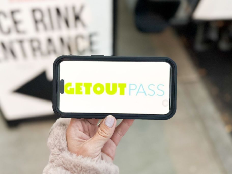 hand holding a phone with a GetOutPass on it