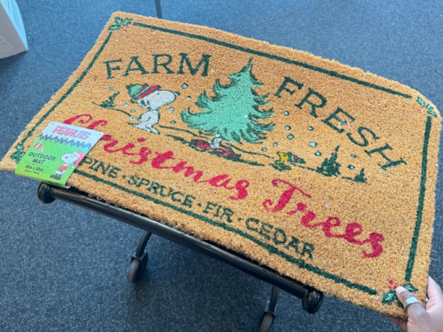 a Christmas doormat with a tree on it that says "Farm Fresh Christmas Trees"