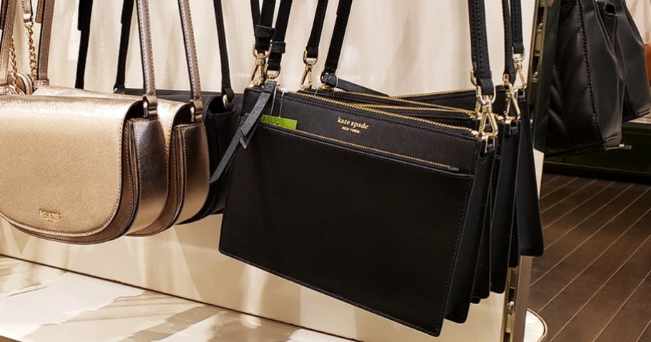 black kate spade crossbody bags on display in store