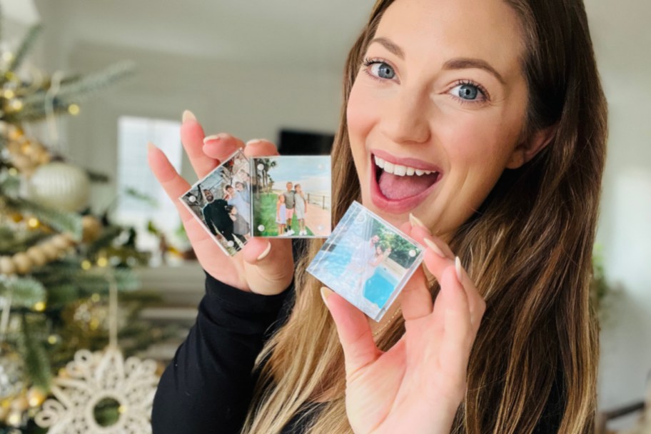 woman holding 3 photo blocks