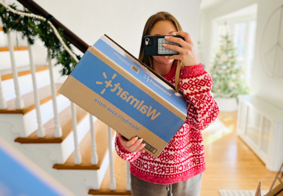 woman holding walmart box in mirror