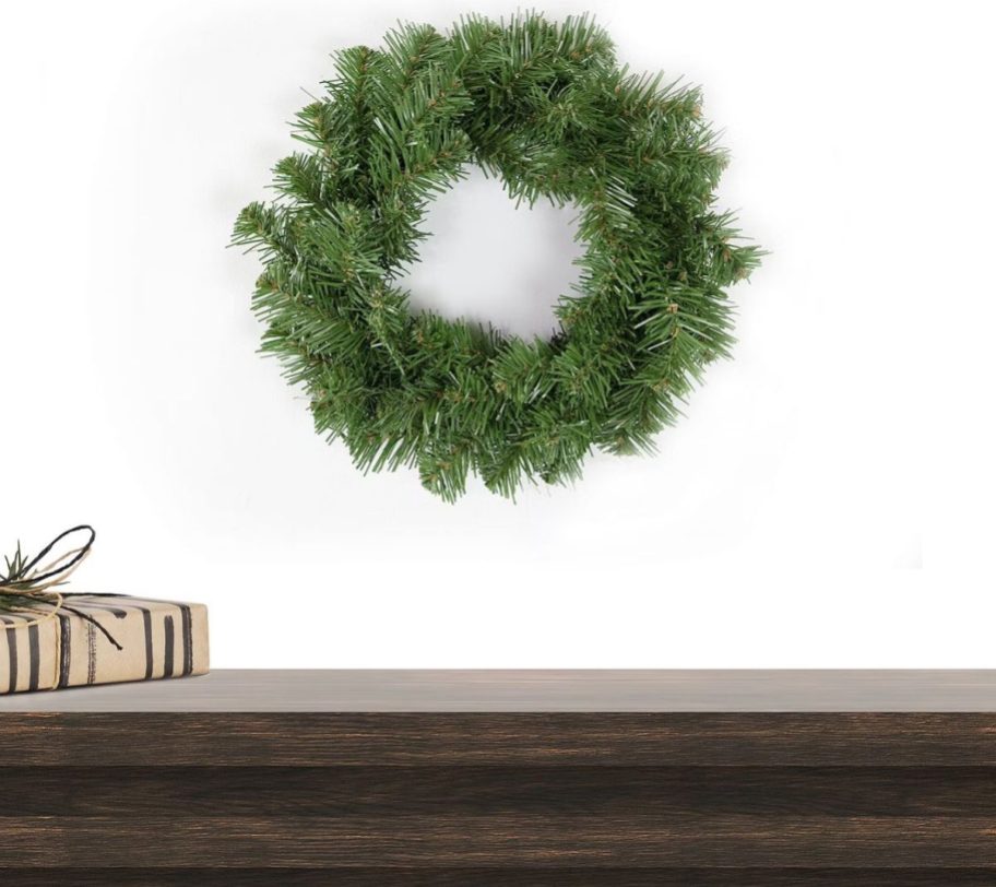 North Pole Trading Co Wreath hanging above a mantle