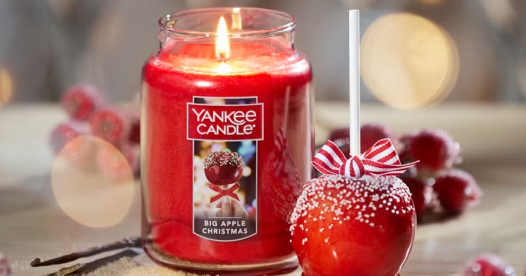 Yankee Candle Big Apple Christmas candle next to caramel apple