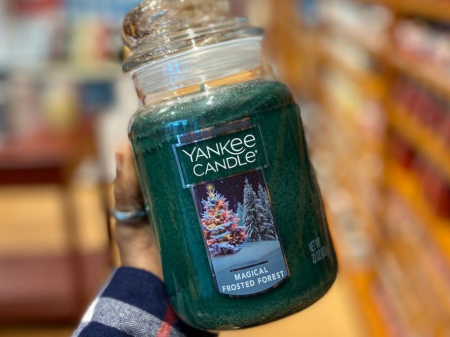 Hand holding a Large Jar Yankee Candle