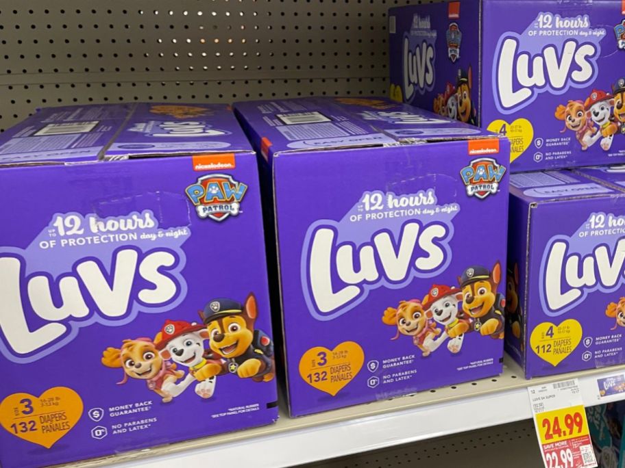 boxes of luvs diapers on shelf