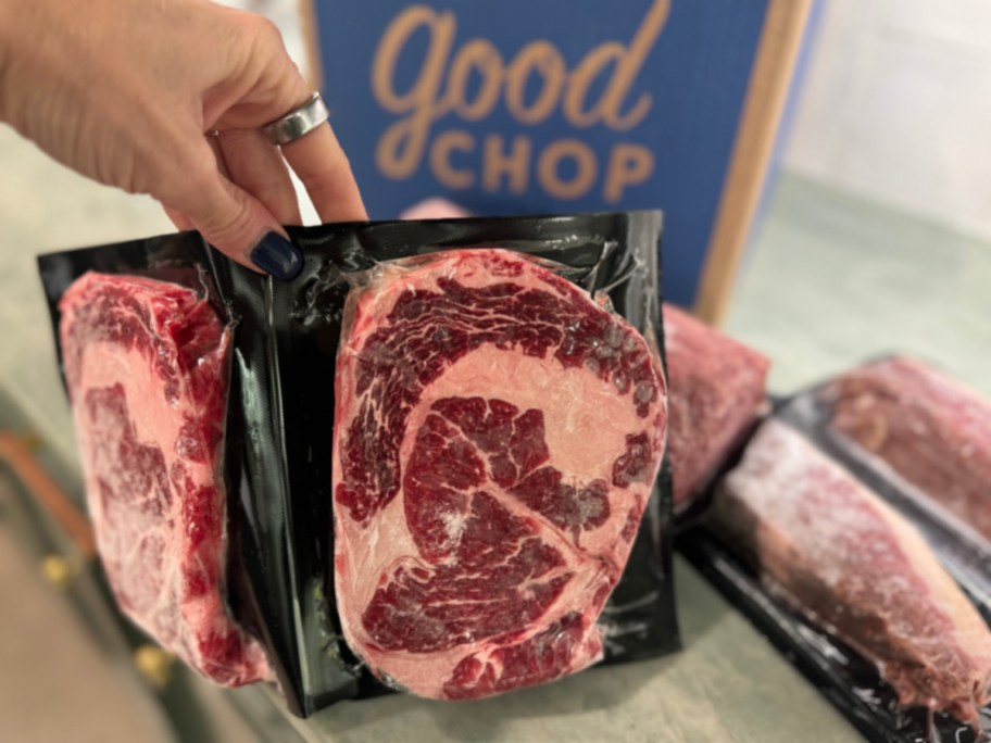 holding meat in front of good chop box