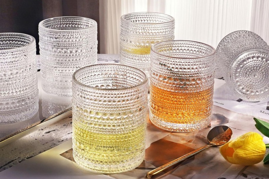 clear beaded glasses with liquid in them