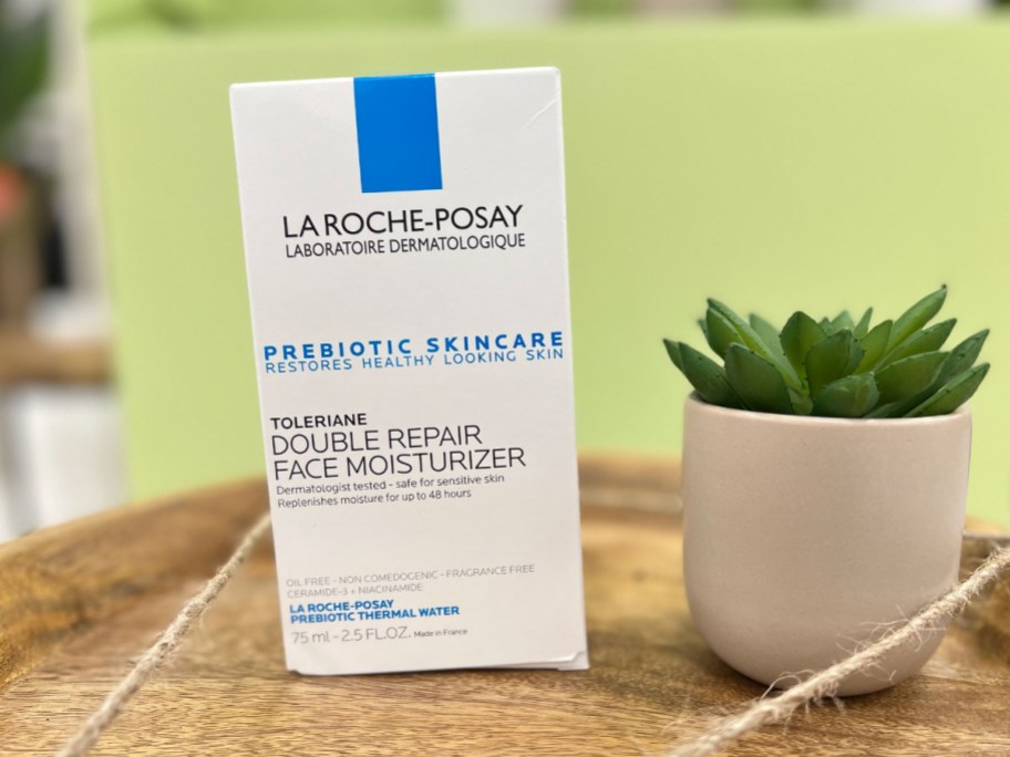 La Roche-Posay Face Moisturizer next to plant