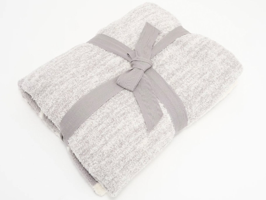 folded gray blanket with bow