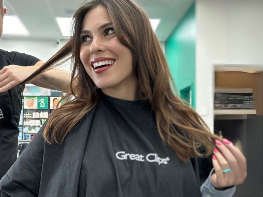 woman getting her hair cut at great clips