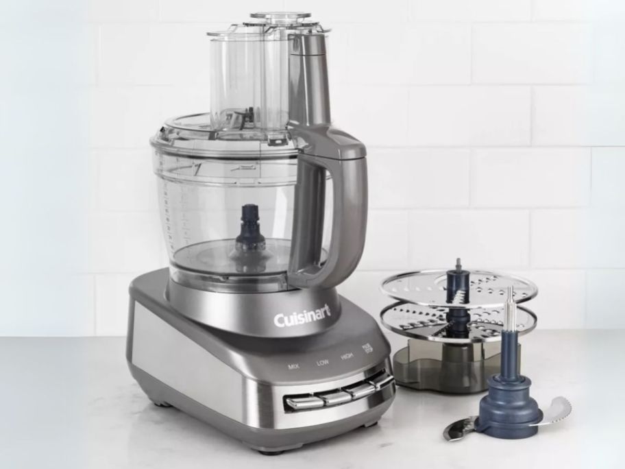 Cuisinart Core Custom 13-Cup Multifunctional Food Processor on counter with attachments next to it