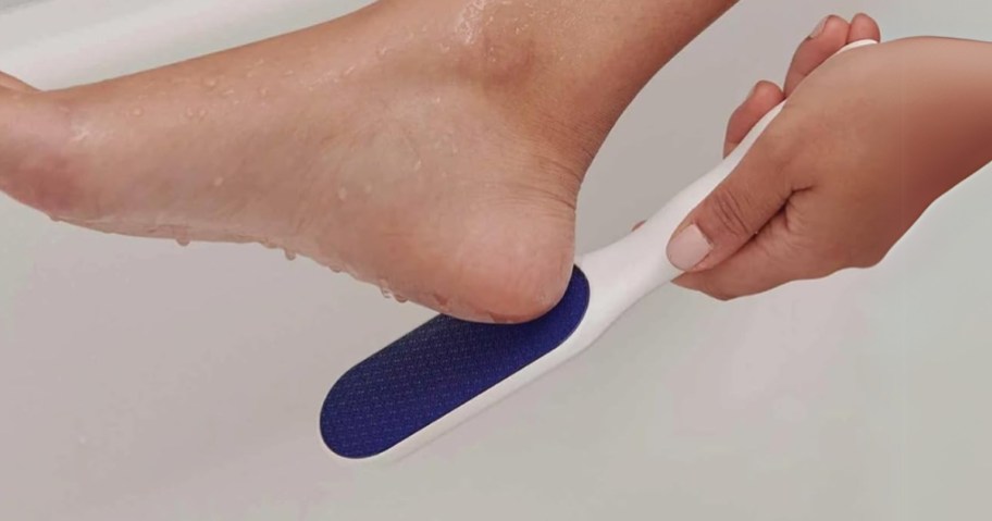 a hand using a blue and white foot <a href='https://www.makertechlab.com/python-file-handling-guide-create-edit-read-delete' target='_blank' rel='follow'>file</a> on the heel of a foot in a bathtub to scrub off dead skin” width=”912″ height=”479″></p>
<p>For a limited time, hop over to <a href=