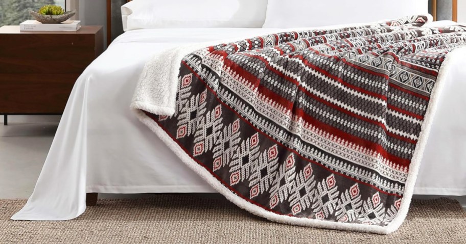 red and black fair isle print throw blanket draped over couch