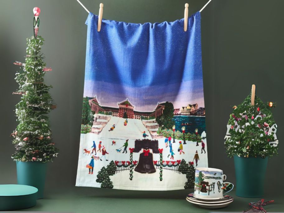 Anthropologie Holiday in the City Dish Towel hanging by clothespins