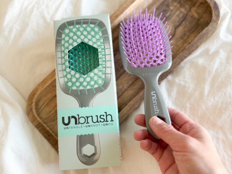 hand holding FHI Heat 2-Piece Unbrush Set