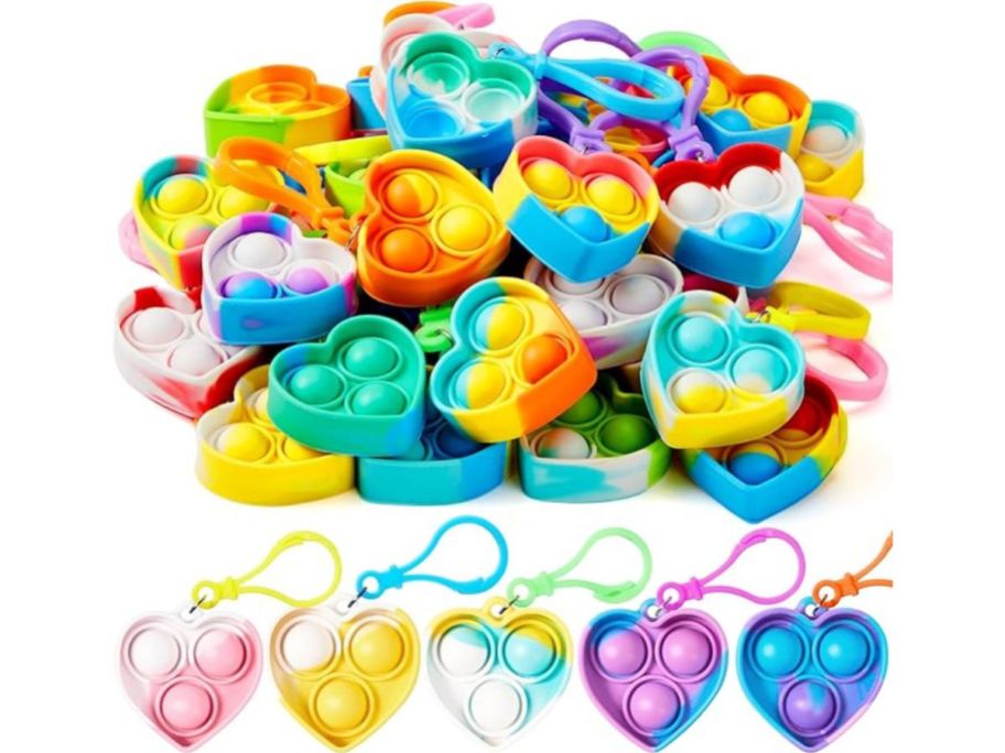 A pile of Heart Pop Fidget Keychains 