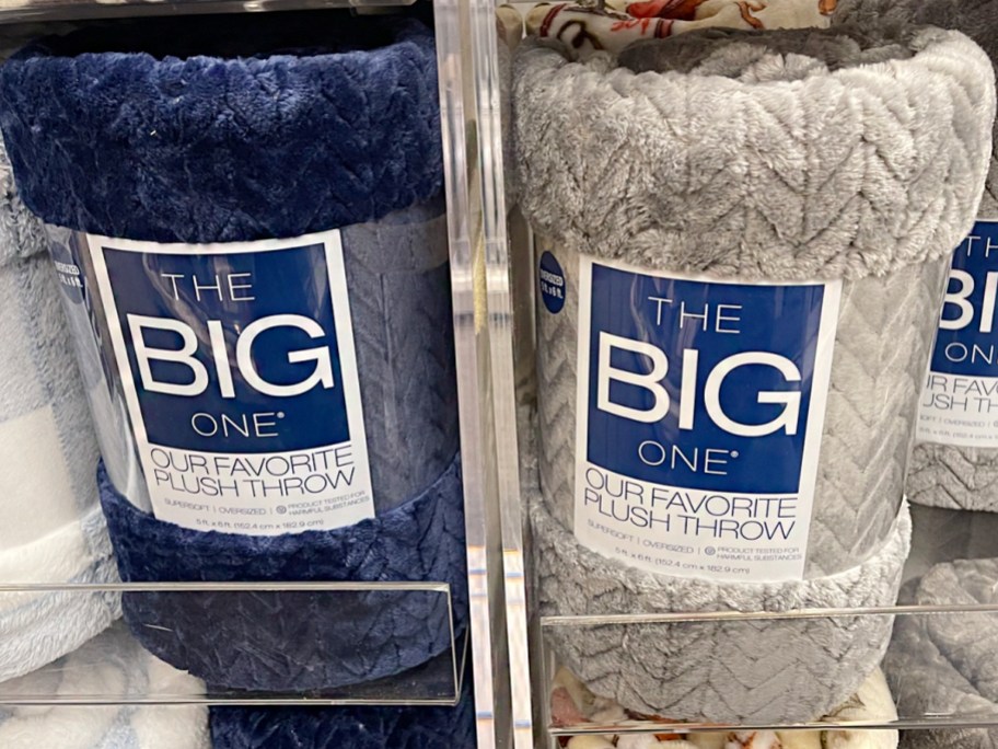 navy blue and gray big one throw blankets on shelf 